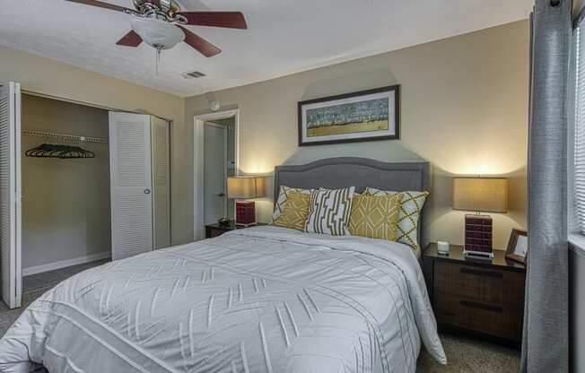 a bedroom with a large bed and a ceiling fan at Wynnwood Vinings Atlanta