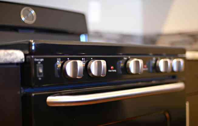 a close up of a stove top oven in a kitchen