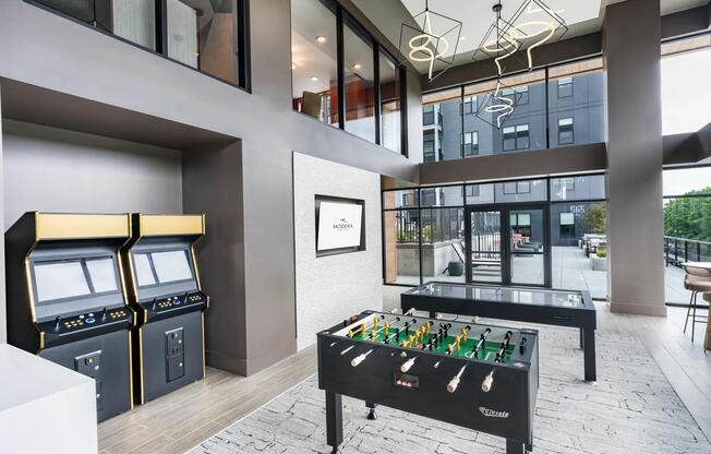 Visit our game room featuring foosball, arcade machines, and sleek seating—perfect for unwinding or friendly competition.