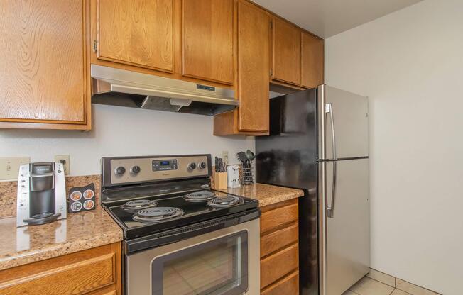 a stove top oven sitting inside of a kitchen