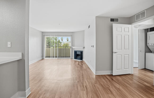 A room with wooden floors and white walls.