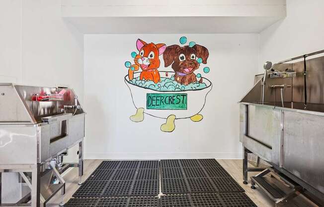 A cat and dog are in a bathtub with bubbles and the word DEFECST on the wall.