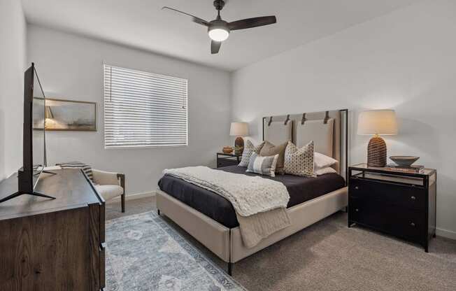 a bedroom with a bed and a ceiling fanat Westbury Apartments, Rancho Cucamonga, California