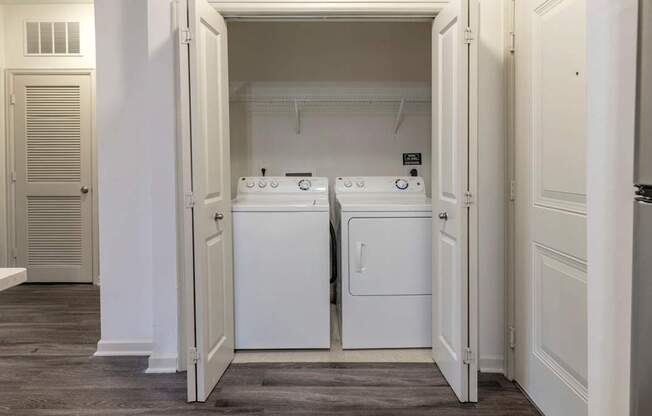 The Hendrix Apartments in Atlanta a laundry room with a washer and a dryer at The Hendrix, Georgia, 30329