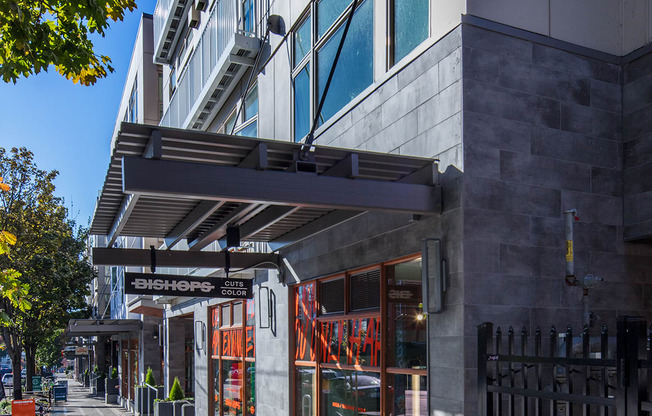 a street view of a building with a sidewalk in front of it at The Hayes on Stone Way, Seattle