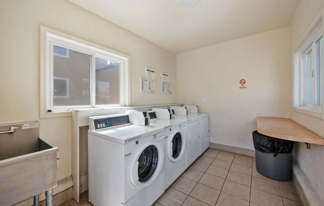 Baldwin Village CA Apartments for Rent - Expansive Laundry Center Featuring Various Washer and Dryer