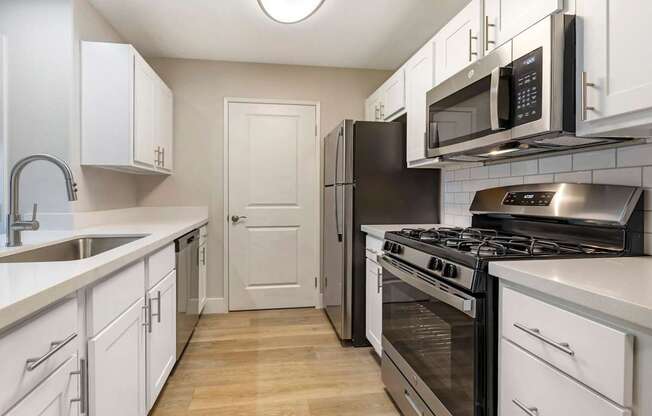 Featuring sleek stainless steel appliances, including a spacious refrigerator and a convenient dishwasher, these kitchens are designed for both cooking and entertaining.