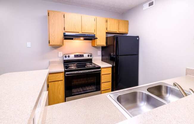 a kitchen with wooden cabinets