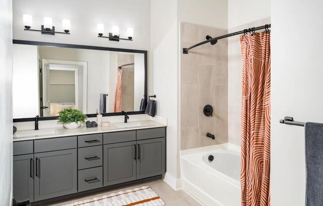 Sophisticated bathrooms at Modera Liberty Row feature dual vanities, sleek finishes, and spacious layouts designed for comfort in Charlotte.