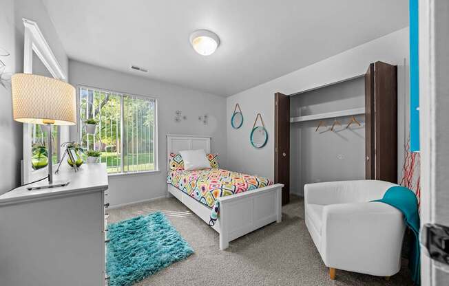 Bedroom with natural lighting at Westwood Village Apartments in Westland, MI
