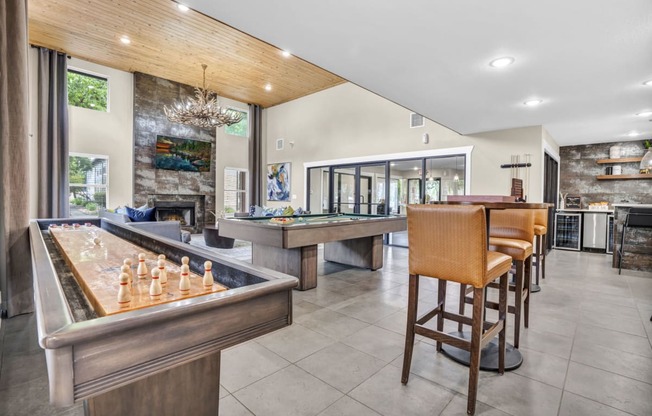 a game room with a bar and a pool table at Sunset Ridge, San Antonio, 78209