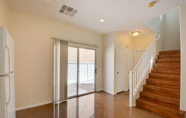 Beautiful two bedroom in great location. Step through the front door into a sun-filled great room featuring oversized tile flooring, recessed lighting, and a modern ceiling fan. Large windows and a glass slider invite natural light and frame the connectio