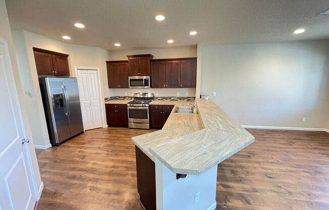 Spacious 4-Bedroom Home with Inviting Curb Appeal, Modern Kitchen, and Backyard Retreat