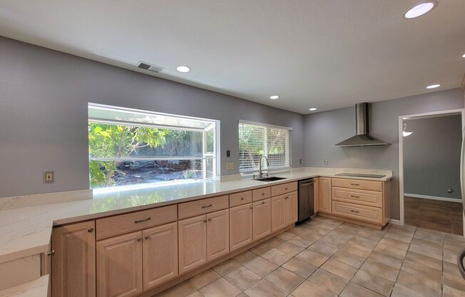 Spacious Beauty with Remodeled Kitchen and your Own Backyard Oasis!