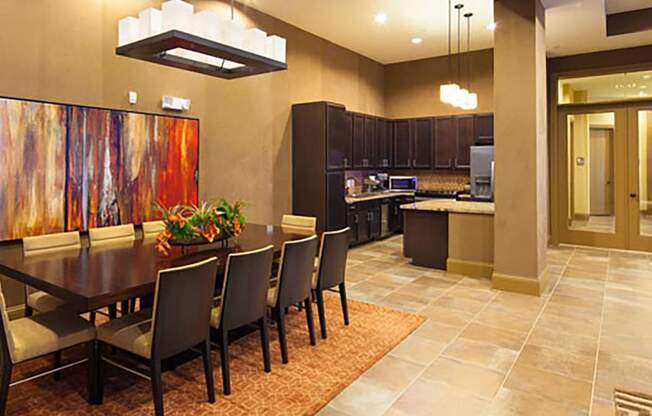 a dining room with a table and chairs