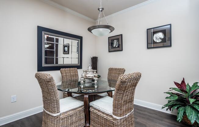 Dining area with circular table and four chairs at Riverstone apartments for rent in Macon, GA