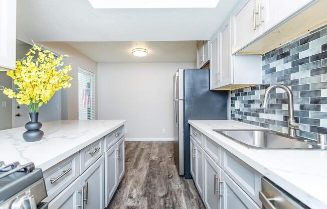 a large kitchen with stainless steel appliances