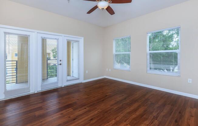 a close up of a hard wood floor next to a window