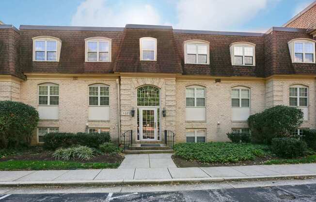 A building with a brown roof and a white door.