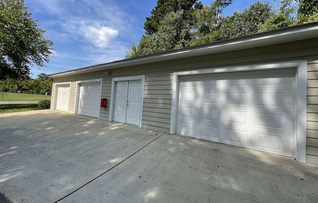 Garage with two garage doors on the side of a house t The Chase, Burlington, NC 27215