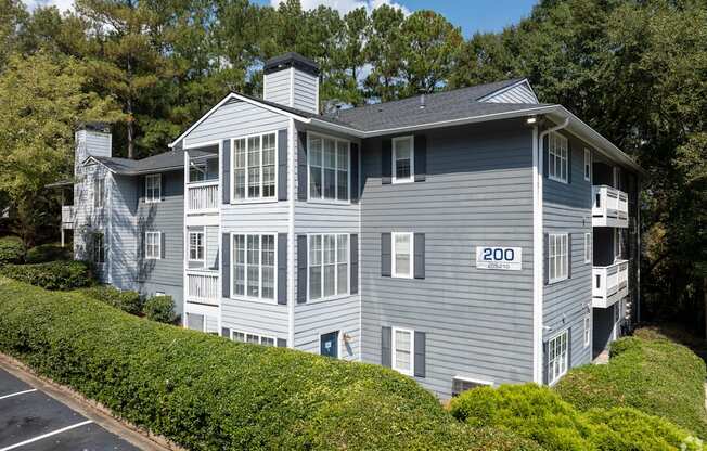 A grey house with the number 200 on it.