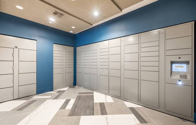 a row of lockers in a blue and white locker room