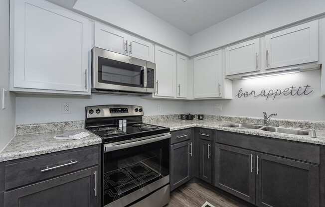 Kitchen appliances and cabinets at Bloomfield Apartments, Dayton