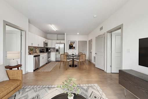 A modern kitchen with a dining table and chairs at The Waterford At Rocketts Landing Apartments, PRG Real Estate, Richmond, Virginia