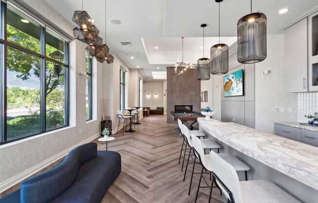 A modern kitchen and dining area with a long table and chairs.