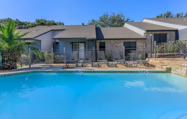 a large pool of water in front of a house