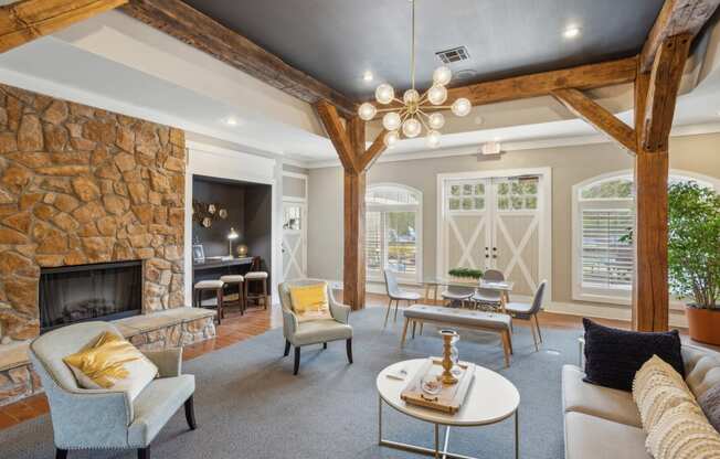 a living room with couches and chairs and a fireplace