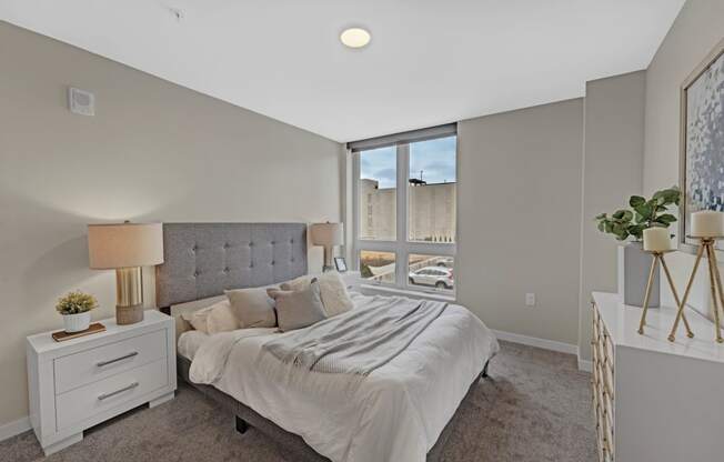 a bedroom with a large bed and a window