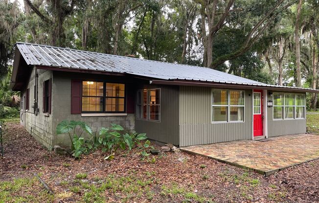 3/2 (Micanopy)  Charming home nestled on 7 acres of wooded land with Live Oak Trees in the historic town of Micanopy filled with antique shops, cafes, and specialty restaurants.