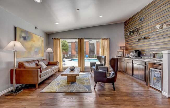 a living room filled with furniture and a large window