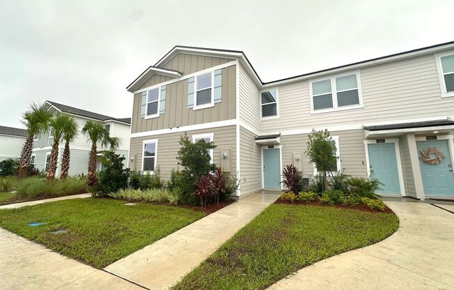 Welcome to this beautifully designed, open-concept townhome featuring a screened-in patio,