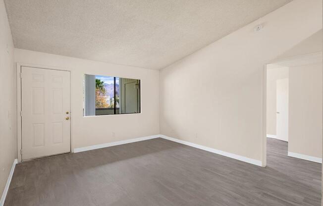 A room with a door and a window.