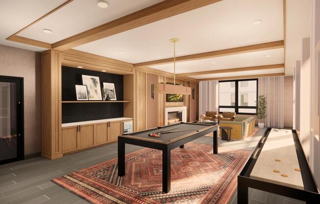 Gather in the game room at Modera Bridle Trails, where warm wood tones, a fireplace, and games create a space to unwind together.