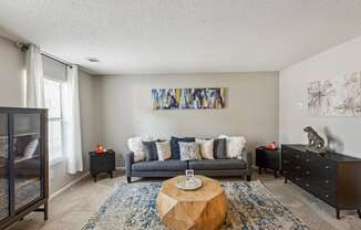 a living room with a couch and a coffee table