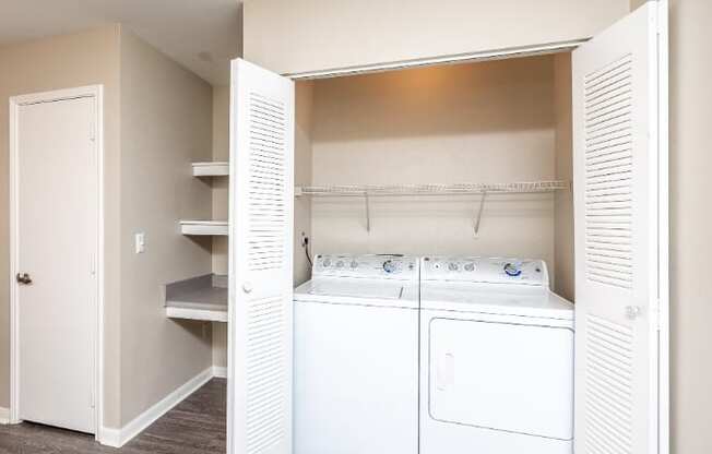 A laundry room with a washer and dryer.