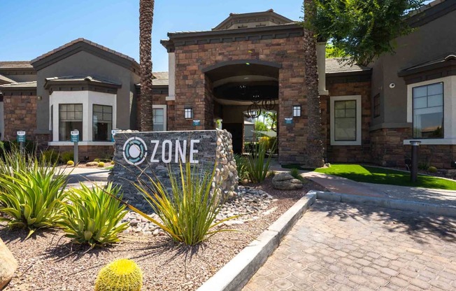 a home with a zone sign in front of it
