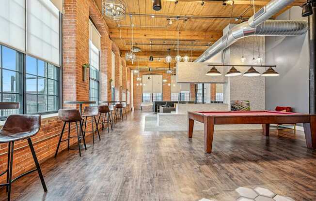 a game room with a pool table and a ping pong