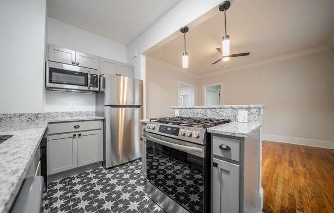 A kitchen with a black and white checkered floor.
