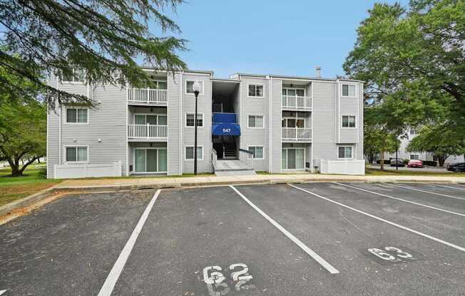 ReNew Odenton apartment building with a parking lot and stairs