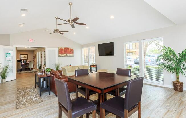 a living room filled with furniture and a large window