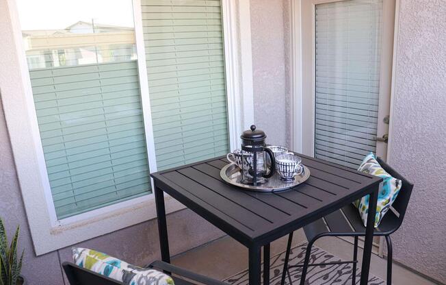 a room with a couch and a table in front of a window