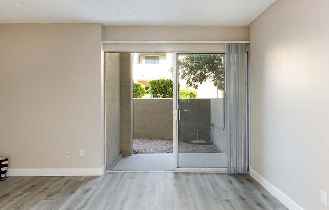 living room with sliding glass doors to an outdoor patio