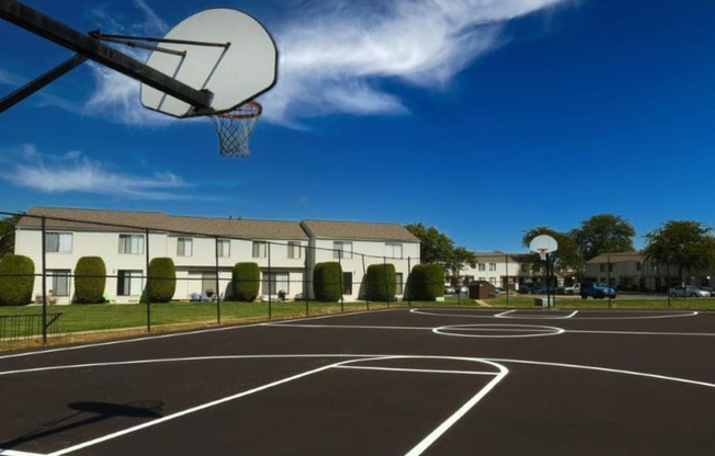 a basketball court in front of a building