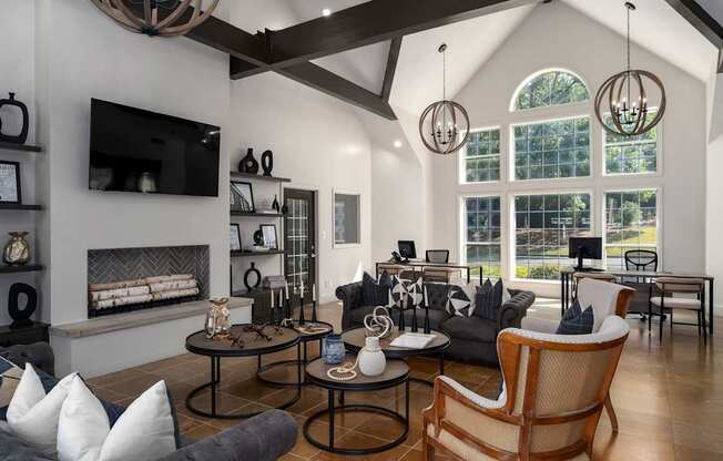 A modern living room with a fireplace and a large window.