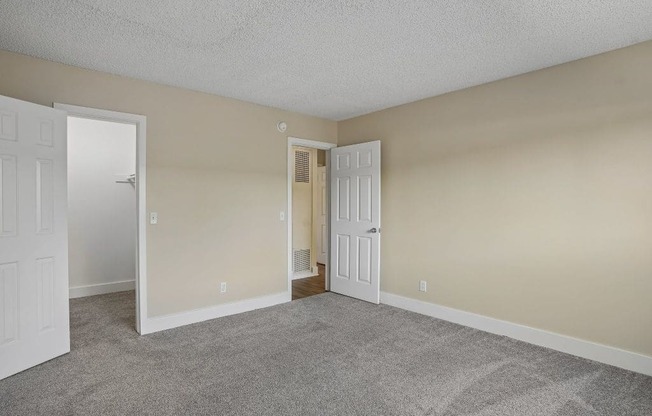 A room with two doors, one of which is open