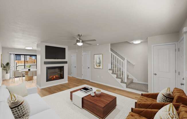 a living room with couches and a table and a fireplace